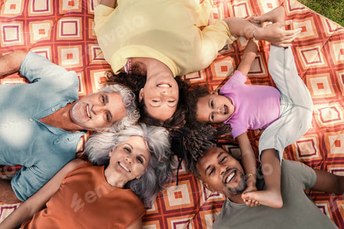 Preview: Joyful Multiracial Extended Family Lying on Garden Grass