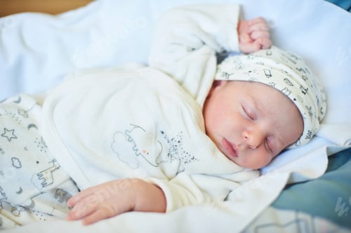 Preview: Cute newborn baby sleeps in white