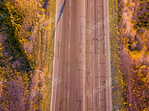 Preview: Aerial view of the Arizona landscape with the infinite road to the horizon