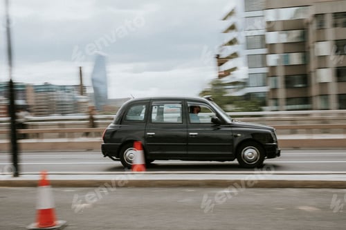 Preview: Vintage car travelling through London street