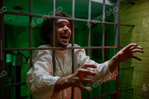 Preview: Mentally ill male patient with attack of rabies locked in cage ward