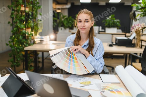 Preview: Interior designer holding color palette swatch creating vision