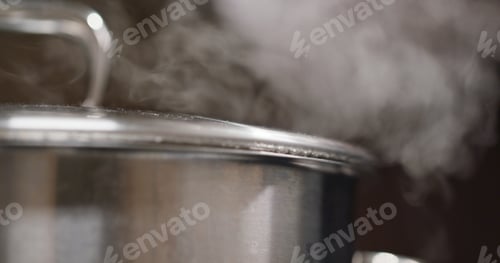 Preview: Pot boiling on a gas stove in the kitchen