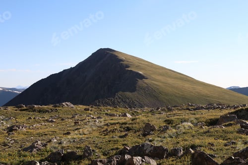 Preview: Grassy Mountain Peak Under Blue Sky