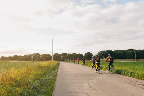 Preview: People exploring countryside on bikes