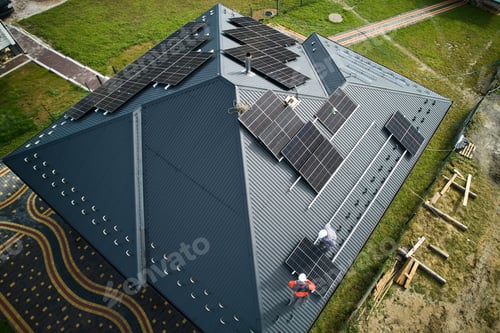Preview: aerial view of house with solar roof