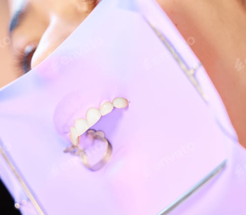 Preview: Ready to get this over with. Shot of a dental patient with their mouth covered before a procedure.