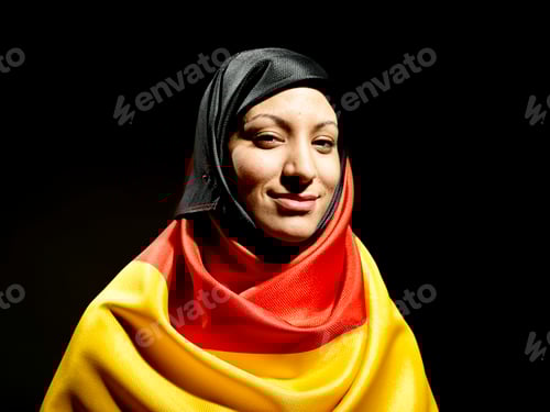 Preview: Portrait of a smiling woman wearing a colorful hijab made of a German flag