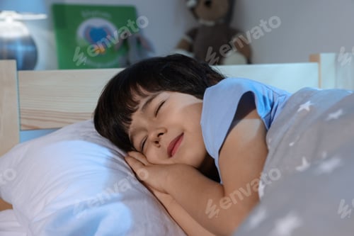 Preview: Cute little boy sleeping in bed at home
