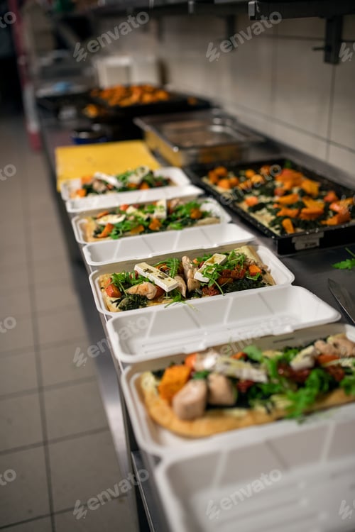 Preview: Meals in containers prepared for take away in kitchen restaurant