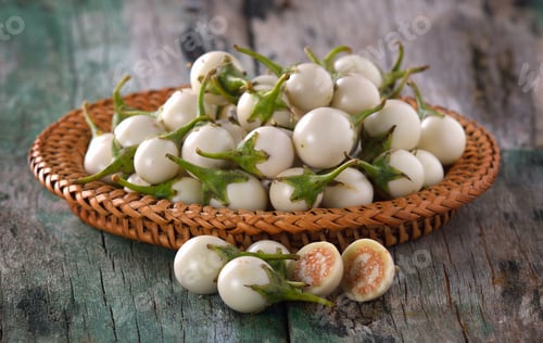Preview: white eggplant on wooden table