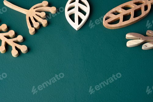 Preview: set of leaves engrave wooden on dark green table background