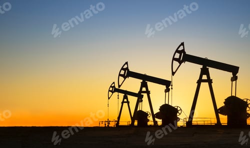Preview: Silhouette of oil wells in desert at sunset, Texas, USA