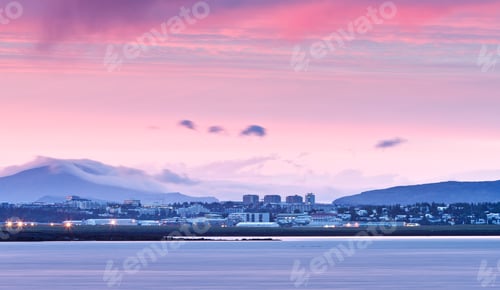 Preview: View over water of Reykjavik skyline at midnight, Iceland
