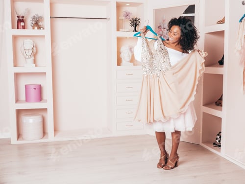Preview: Portrait of young beautiful brunette woman posing in pink wardrobe