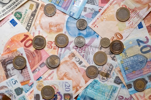 Preview: US dollars,Euro,Sterling and Turkish Liras,coins on top of each other completely covering the screen