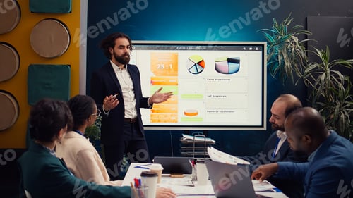 Preview: Team leader showing infographics data on interactive board