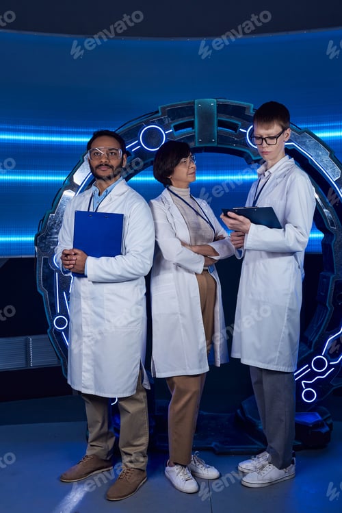 Preview: futuristic concept, forward-thinking multiethnic science team near new equipment in science center