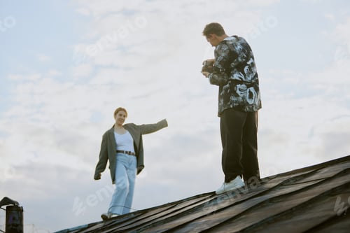 Preview: Individuals Standing on Rooftop during Daytime