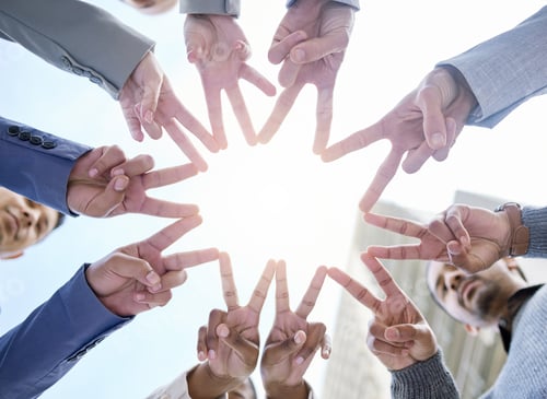 Preview: Shot of a group of unrecognizable businesspeople making a star shape with their hands