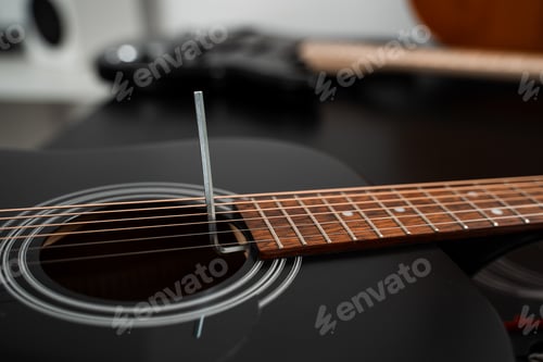 Preview: Guitar maintenance process. Adjusting truss rod with hex key