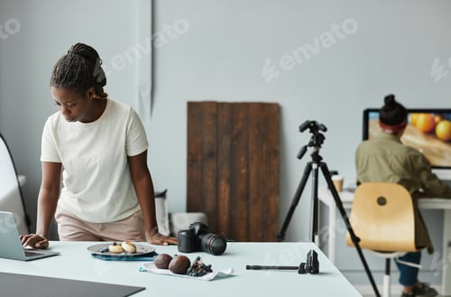 Preview: Black Female Photographer Working in Studio
