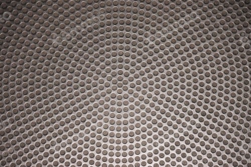 Preview: Striking close-up of a speaker grille.