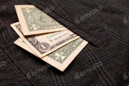 Preview: There are dollar bills sticking out of his pocket.