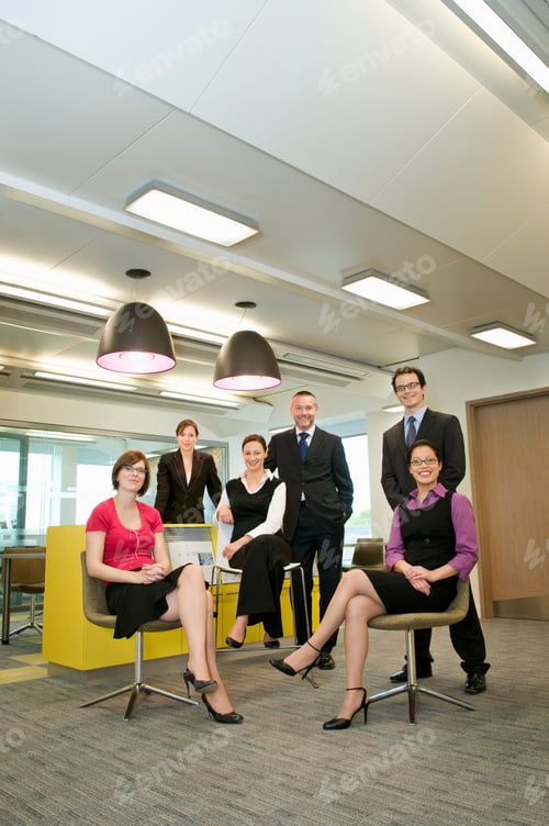 Preview: Business colleagues pose for photograph