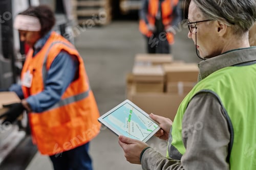 Preview: Manager checking the delivery route on tablet pc