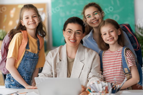 Preview: Happy kids and teacher at school
