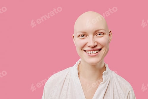 Preview: Portrait of Young Adult Woman Smiling Confidently with Alopecia