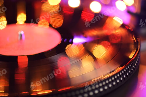 Preview: Vinyl player LP record with blured or defocused lights.