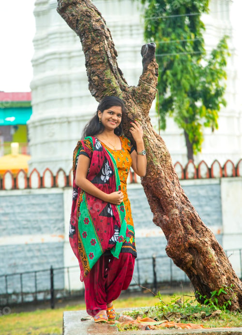Preview: Happy young beautiful Indian woman at the park outdoor