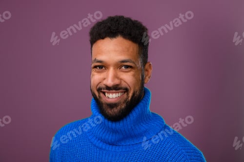Preview: Portrait of happy multiracial man in knitted sweater.