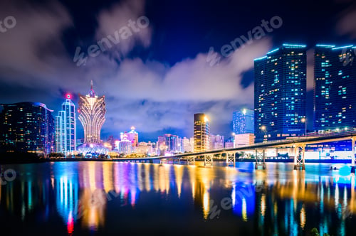Preview: Macau cityscape at night, all hotel and tower are colorful lighten up with blue sky, Macau, China.