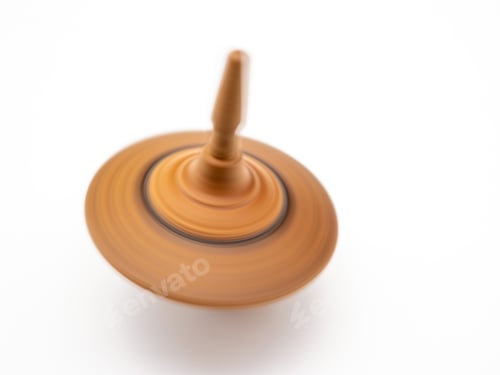 Preview: Closeup shot of a wooden spinning top isolated on a white background
