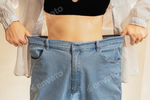 Preview: Slim figure of woman in wide jeans.