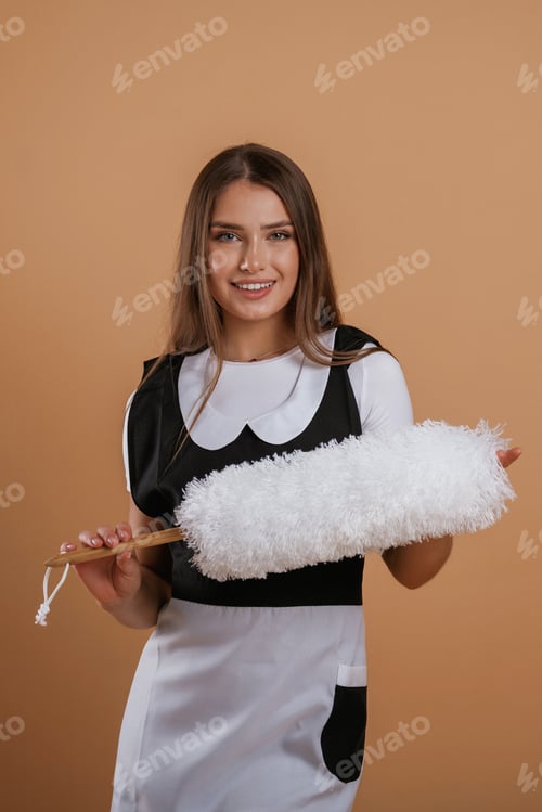 Preview: Occupation of chambermaid. Young pretty woman is against background in the studio