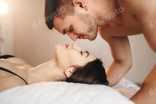 Preview: Love couple lies on big white bed, sex romance