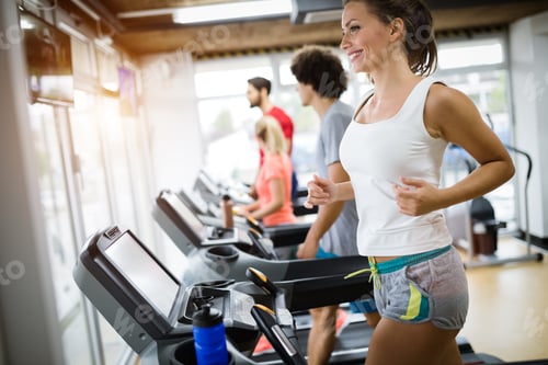 Preview: Group of friends exercising on treadmill machine