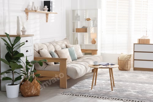 Preview: Beautiful sofa with cushions and coffee table in living room. Interior design