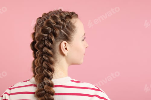 Preview: Woman with braided hair on pink background, space for text