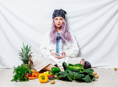 Preview: Beautiful caucasian vegan woman with vegetables