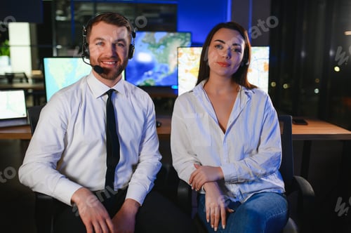 Preview: Diverse call center operators team use computers consulting clients in office