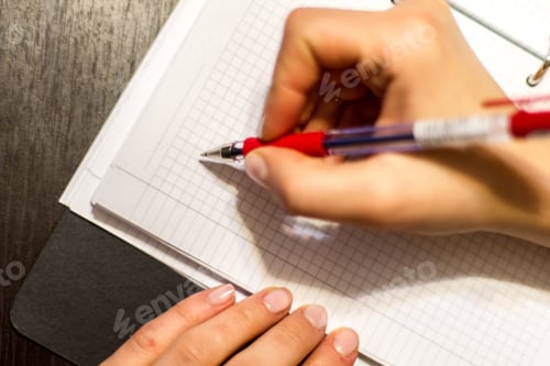 Preview: Writing on a notepad with a pen