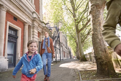 Preview: Boy running in the street with mother