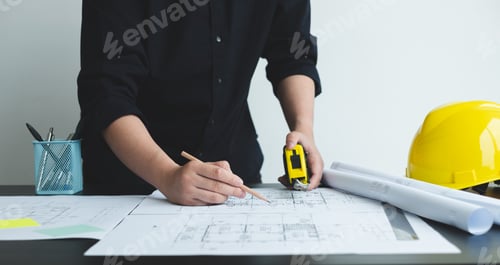 Preview: Architects or engineers working construction and drawing construction plans, printing, writing