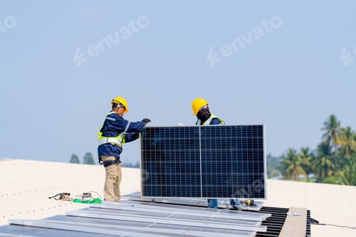 Preview: workers installing solar panels, for efficient energy on rooftop