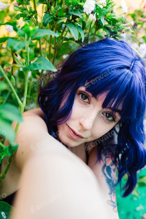 Preview: Photo of adorable young woman making selfie outdoors backyard